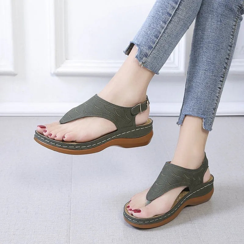 Women's casual wedge heel flip flop sandals with an adjustable back strap in solid colours.