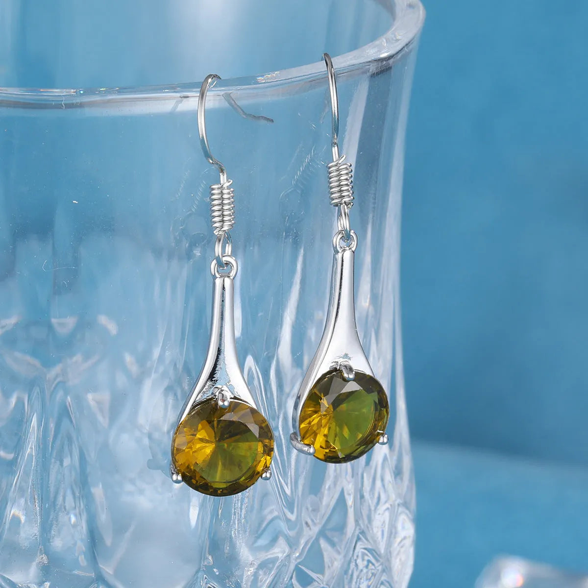 Olive green topaz colour water drop shaped earrings with retro minimalist design