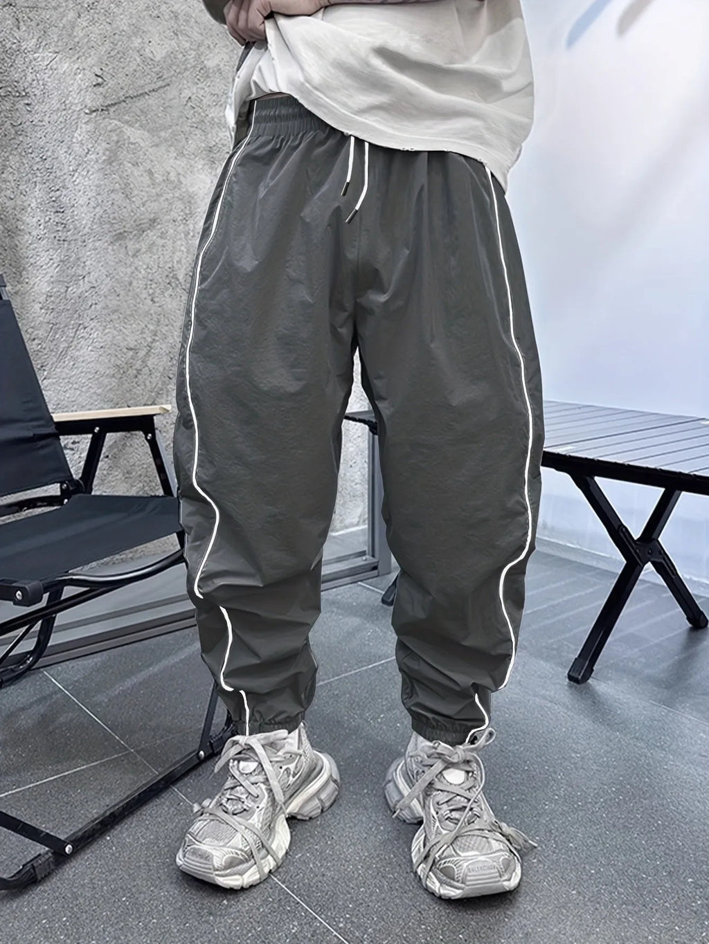 Men's loose-fit cropped casual trousers in bamboo fabric, shown in Army Green colour.