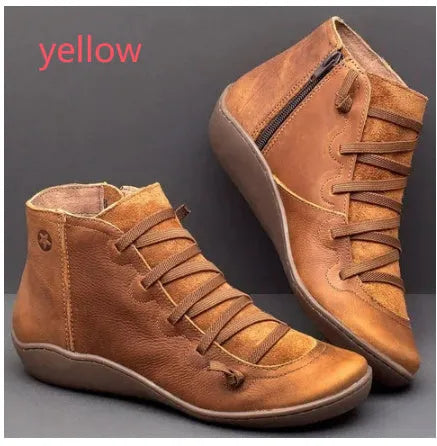 Women's flat wedge heel ankle booties in various colours including leopard print, with round toe and rubber sole.
