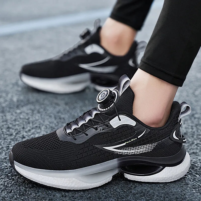 White rotating buckle low-top running shoes with breathable fly-knit mesh upper on a grey background.
