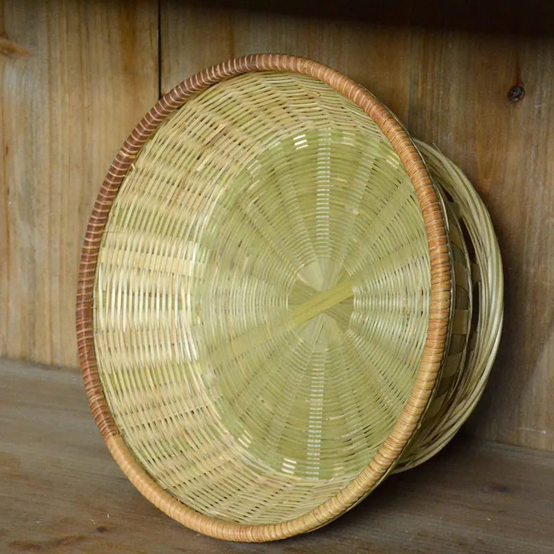 Handmade natural bamboo storage basket in woven construction showing three size options