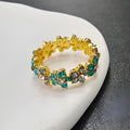 Gold or silver alloy elephant ring fully set with diamond-like stones, showing detailed design.