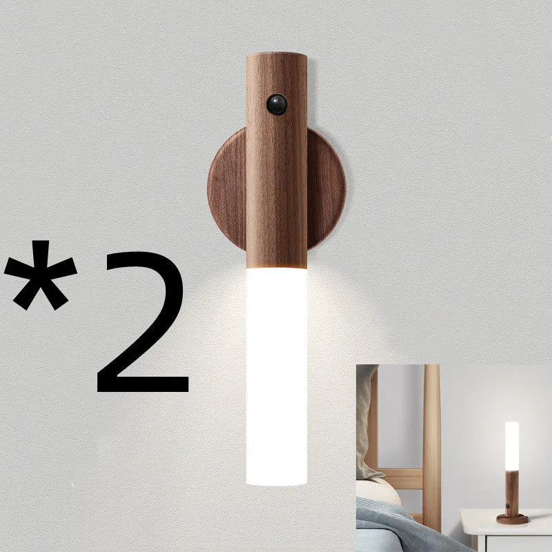 Compact wooden and acrylic motion sensor LED desk lamp on a desk
