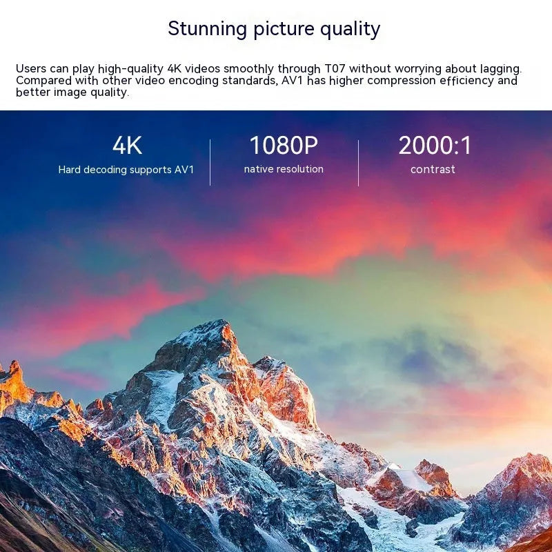 White T07 Full HD smart projector with remote control on a grey surface.