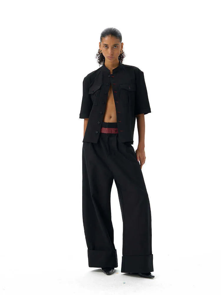 Handmade black half-sleeve hunting shirt with a shirt collar on a mannequin