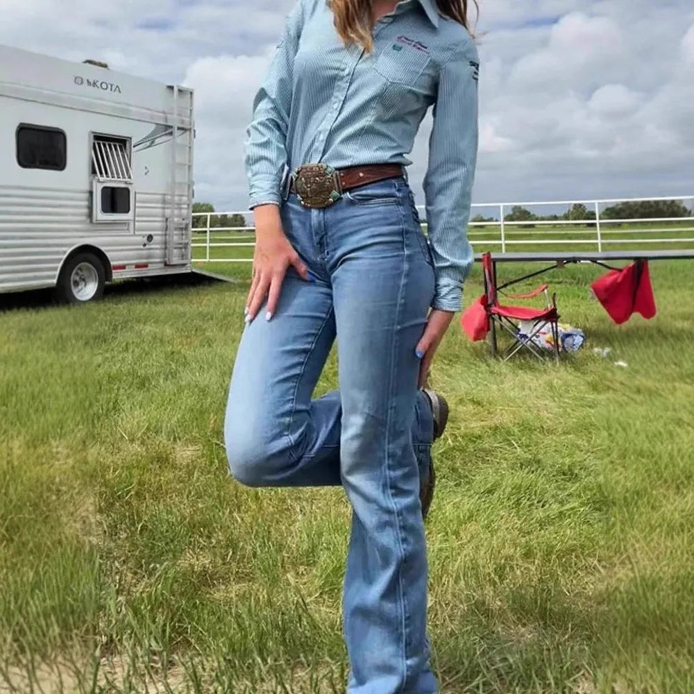 Slim fit blue embroidery jeans with elastic denim and a slight flared leg on a mid-waist.