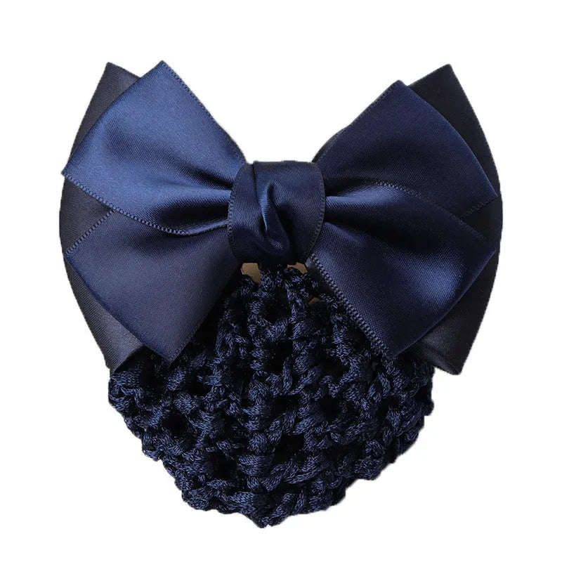 Professional flower bow headdress hair clip ornament on a work plate, shown in a selection of net and mesh colour variations.