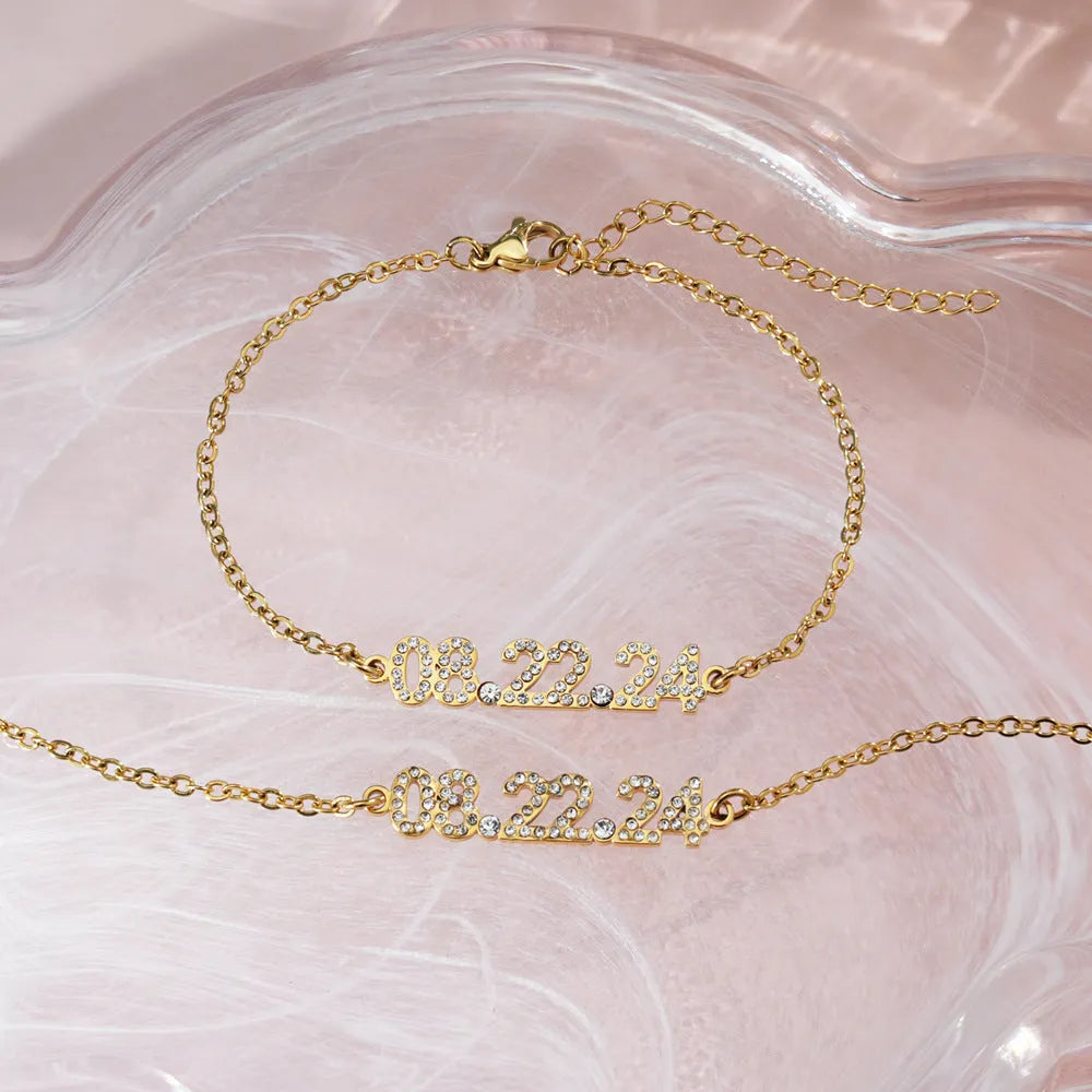 Stainless steel digital bracelet with diamond-set numbers in gold, rose gold, or steel colour.