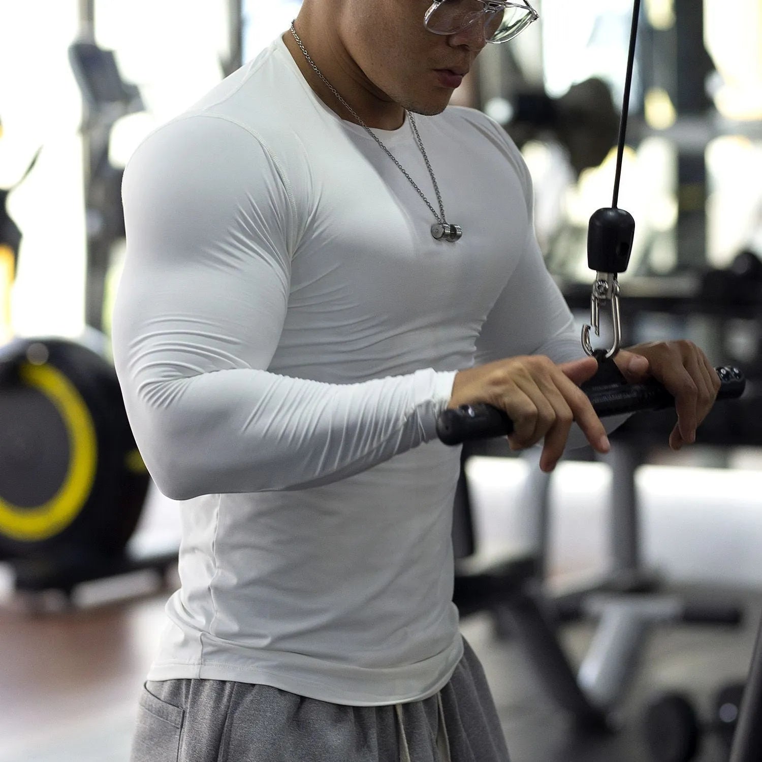 Men's black slim-fit long sleeve fitness tights for running and gym workouts