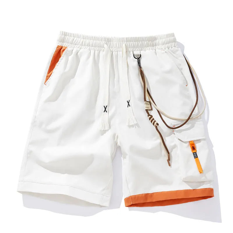 Man wearing loose-fitting black bamboo fibre sports shorts with a straight-leg cropped cut.
