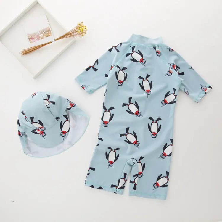 Boys' penguin pattern swimsuit set with long sleeves and matching swimming cap