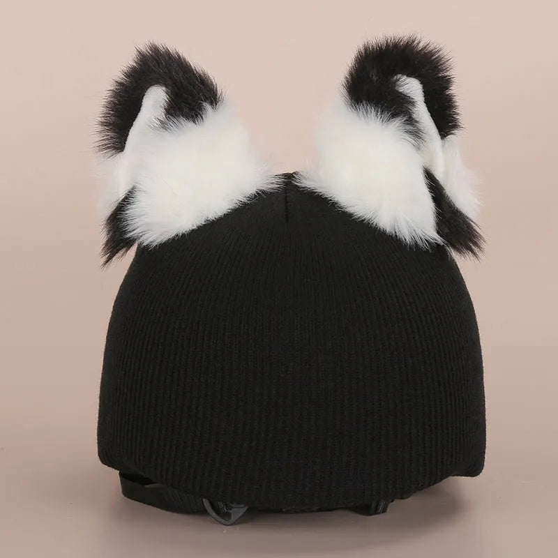 A plush fabric cartoon character helmet hat cover with attached ears on a white background.