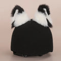 A plush fabric cartoon character helmet hat cover with attached ears on a white background.