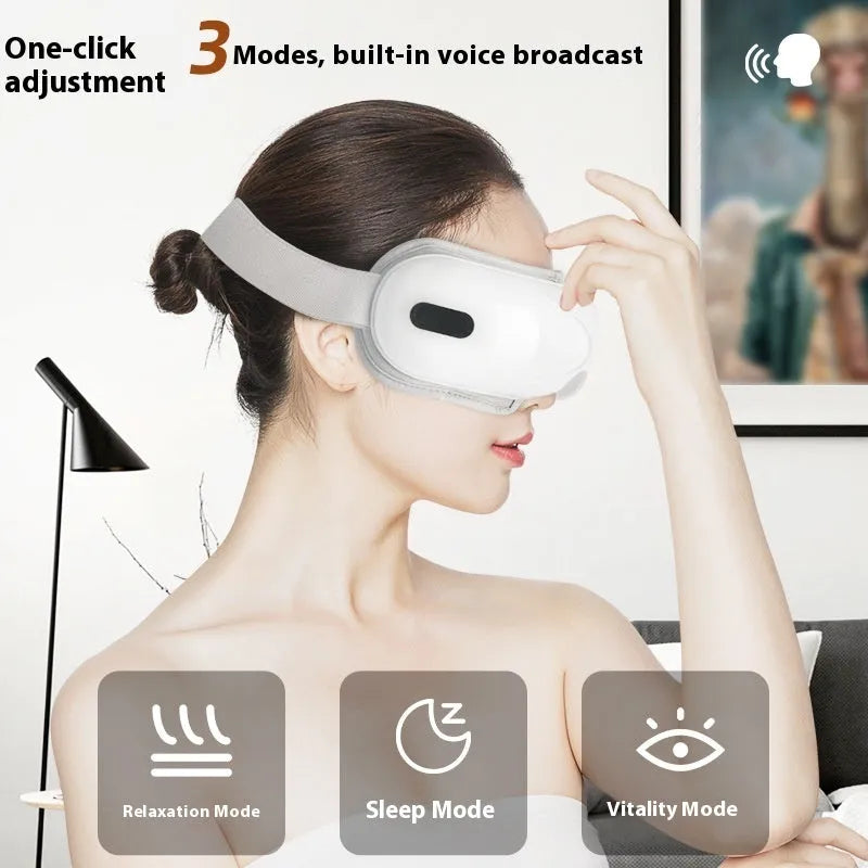 White rechargeable eye massager with airbag massage and hot compress functions showing compact design
