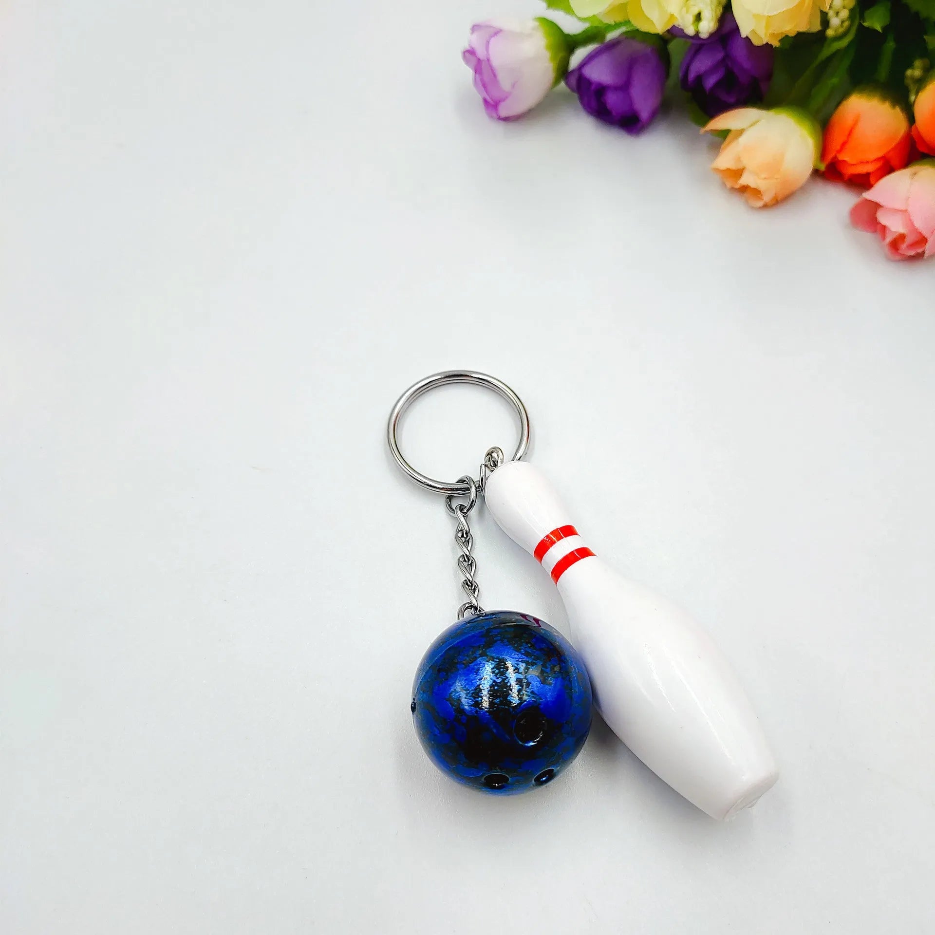 Mini bowling ball keychain pendant in blue colour with metal ring