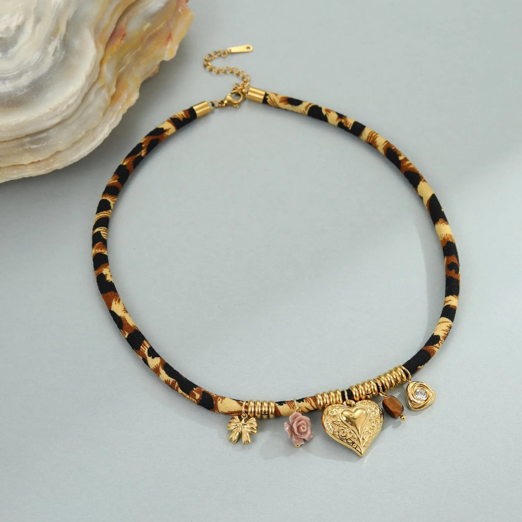 Geometric leopard pendant necklace with gold electroplated finish on adjustable stainless steel chain