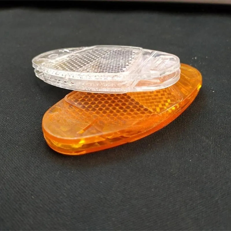 Bicycle spoke reflector set showing four plastic units in yellow colour with dimensions 7.2cm by 3.5cm