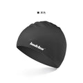 Silicone swimming cap with a graphic letter pattern, shown in one of five colours: black, white, yellow, blue, or grey.